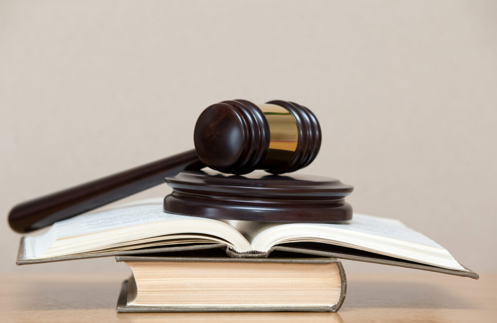 wooden gavel and books